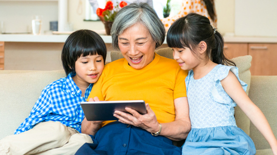 A grandmother spends time with her grandchildren.