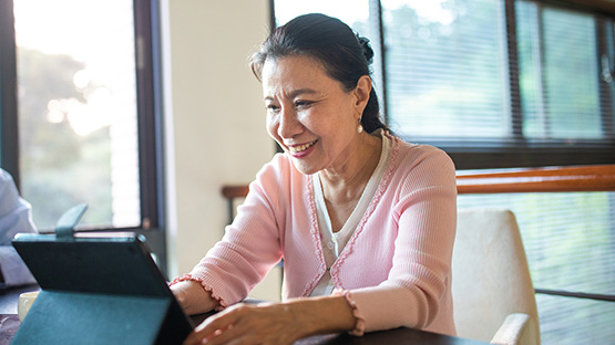 A woman uses a computer.